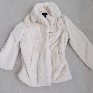 This is white faux fur coat size large, from the Rachel Zoe line